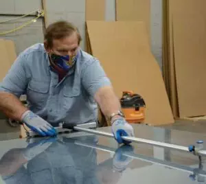 Man measuring glass - innerglass window systems